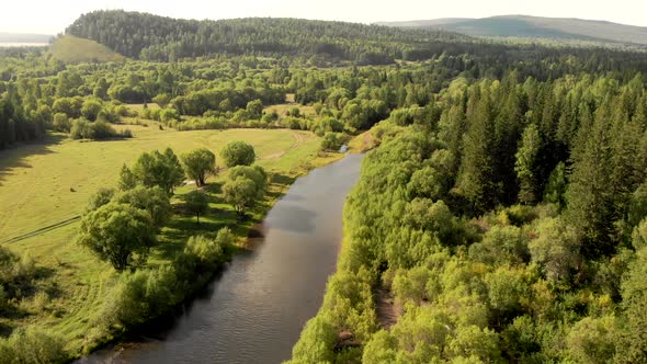 Aerial Flying of Drone Over Mountain River, Field, Forest and Path