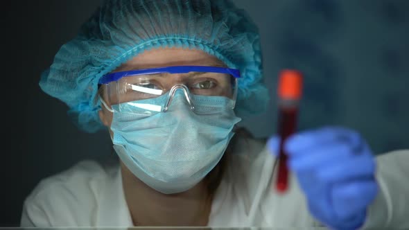 Medical Lab Worker Analyzing Blood Serum, Conducting Paternity Blood Test, DNA