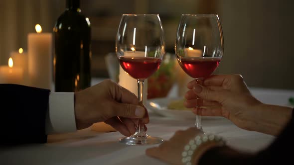 Senior Husband and Wife Kissing During Date in Restaurant, Aged Couple in Love