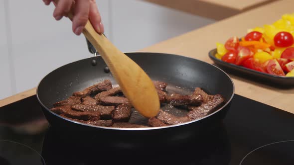 Frying Beef Strips in Pan