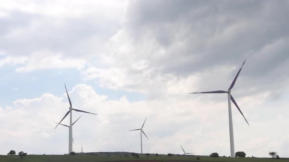 Rotating Wind Turbines On Field