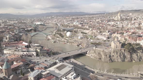 Aerial view of Metekhi church in old Tbilisi located on cliff near river Kura. Georgia 2021 Spring
