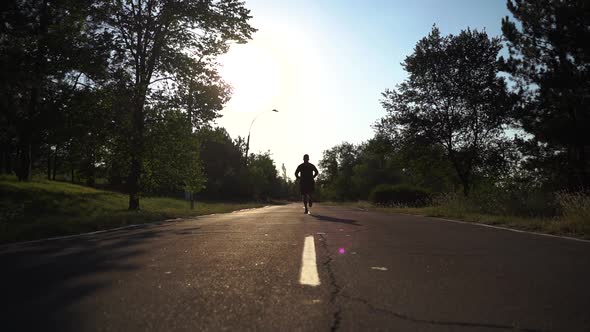 Slow Motion of a Running Man Workout Runner Man In Sportswear Exercising For Triathlon And Sprinting