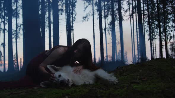 Young woman caressing a dog