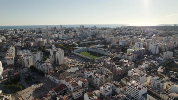 Portimao cityscape against Atlantic Ocean and blue sky. Aerial view