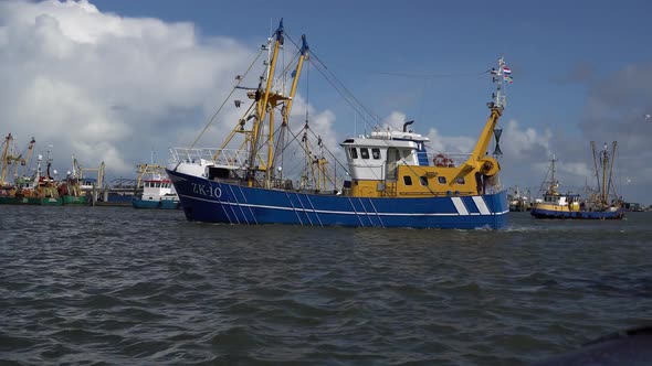 Fishing Trawler sailing from dock. Lauwersoog. Netherlands