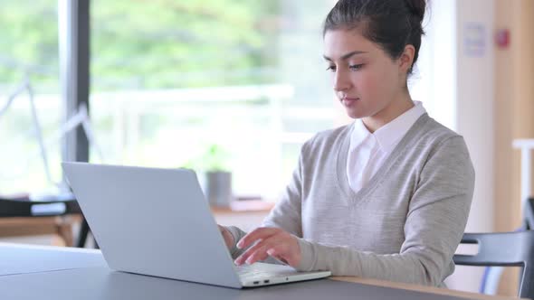 Ambitious Indian Woman Working on Laptop at Work 