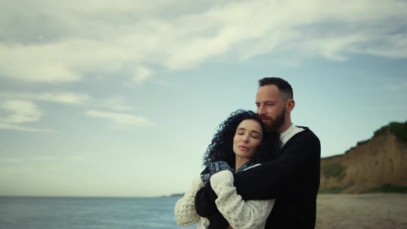 Romantic People Hugging at Seaside Beach