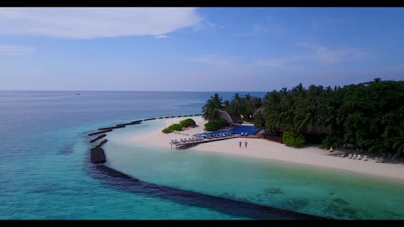 Aerial drone view tourism of beautiful shore beach trip by blue ocean with white sandy background of