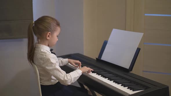 Little Girl Playing the Piano