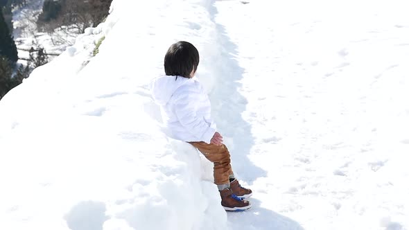 Cute Asian Child Playing Snow Outdoors Slow Motion