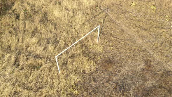 Construction of soccer goal in the field aerial 4K video