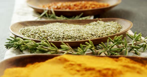 Various spices with herbs in a tray 4k