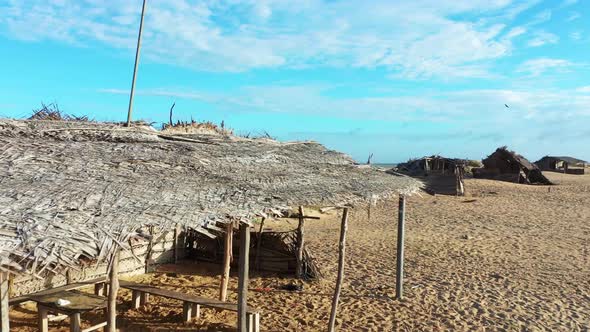 Thatched huts on Kalpitiya beach, Puttalam, Sri Lanka | Cinematic aerial drone footage