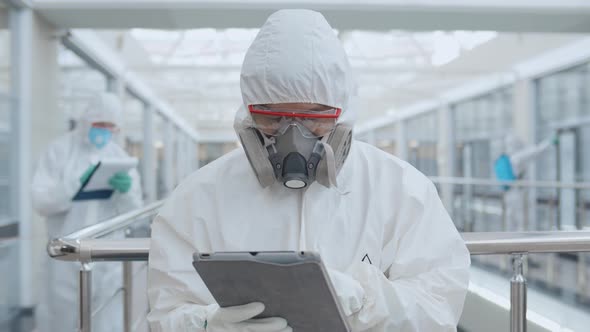 Scientist Using Tablet Pc Controlling Disinfection Process