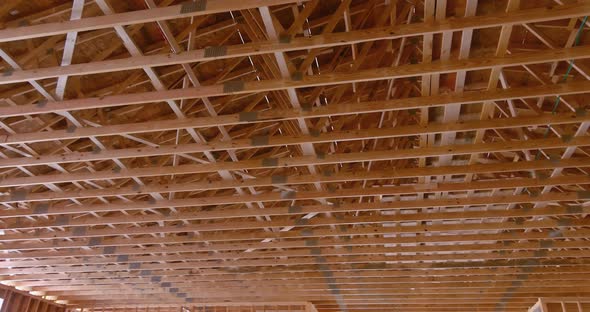 View of the Interior of a Wooden Building Showing the Wood Beam Framework Supported By Wooden Truss