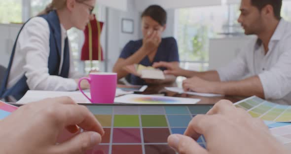 Cropped Shot of Fashion Designer Looking at New Color Palettes on Tablet in Office