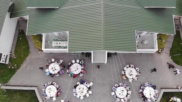 Top View of the Terrace of a Beautiful Manor House with Guests and Groom with the Bride at the Laid