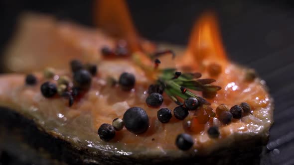 Seasoned Salmon Is Fried Over an Open Fire.