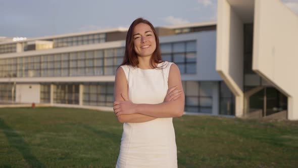 Beautiful Young Woman Wearing White Dress Posing During Sunset