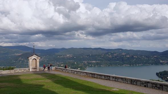 Panoramic view of Orta lake from Madonna del Sasso sanctuary in Italy. Pan left