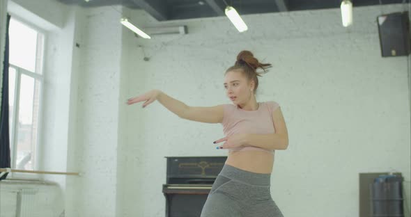 Fully Engrossed in Dance Woman Performing in Studio