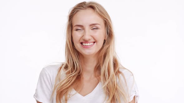 Young Beautiful Caucasian Blonde Girl Smiling Laughing on White Background