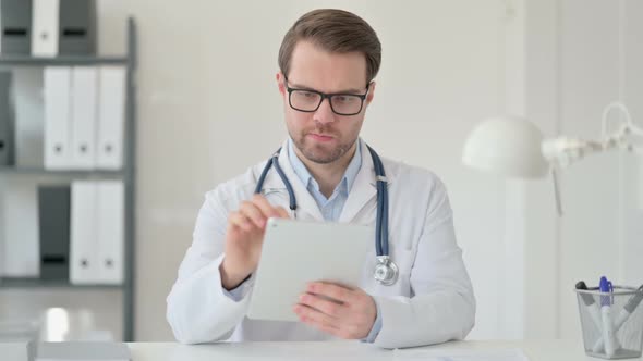 Male Doctor Using Digital Tablet