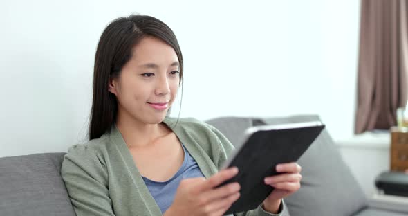 Woman use of digital tablet at home