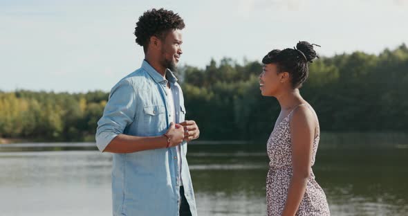 Girl in Dress Meets Friend Boy Nervous About Conversation Improves Shirt Tells Woman Story They Hang