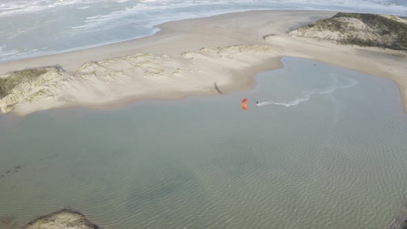 Arial view of a person doing windsurf in Retranchement, Netherlands.