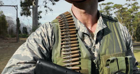 Military soldier during training exercise with weapon alt