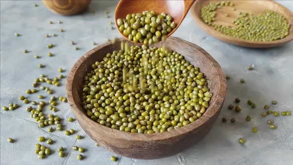 Dried mung beans on a plate with a spoon close up