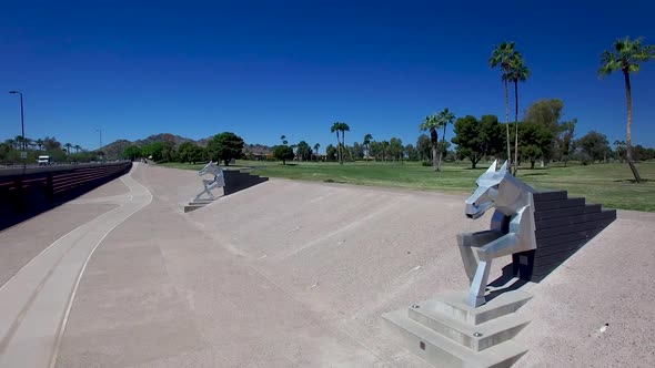 Drone footage of huge metal sculptures of horses used for flood control, ?Indian Bend Wash, Scottsda