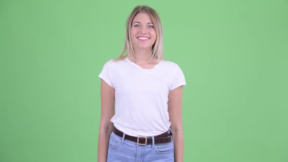 Happy Young Beautiful Blonde Woman Smiling