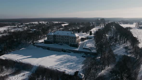 Aerial View Drone Flight Forward Over the Historic Old Castle at Sunny Winter Day Pidhirtsi Palace