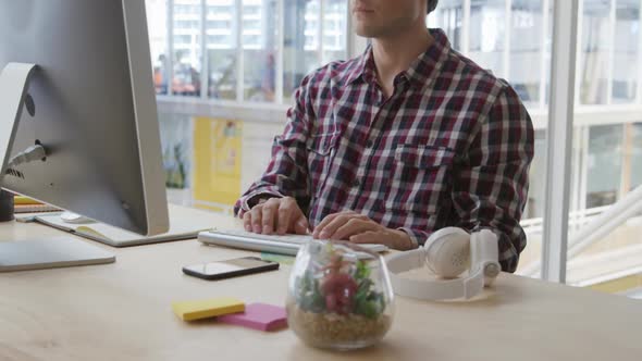 Young man working in a creative office