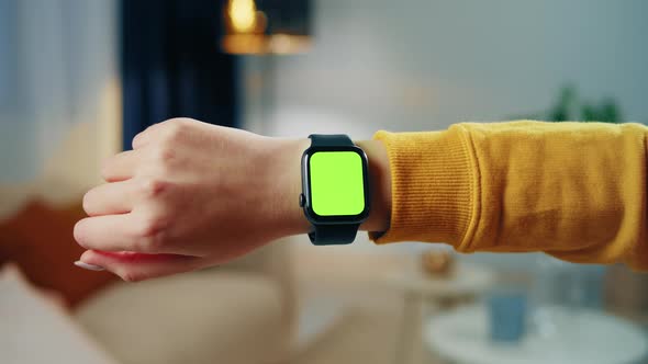 Woman Using Smartwatch with Chroma Key Closeup