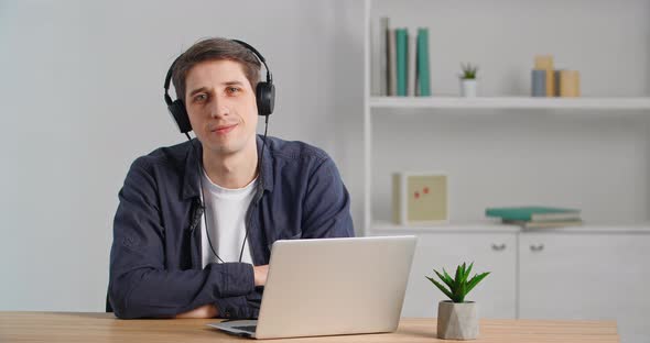 Calm Businessman Freelancer Student Caucasian Male Millennial Sitting at Table in Home Office Taking