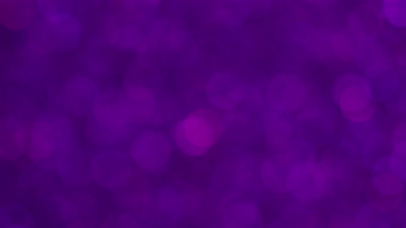 Bokeh Effect of Sparkling Bright Purple Glitters  Macro Shot