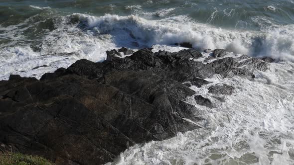 Waves splashing on rocks. Le Pouldu, Finistere department, Brittany, France