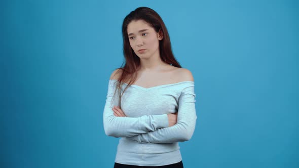 The Disappointed Girl Crosses Her Hands with a Pipette Moves Her Gaze Down and Puts Her Lip Upside