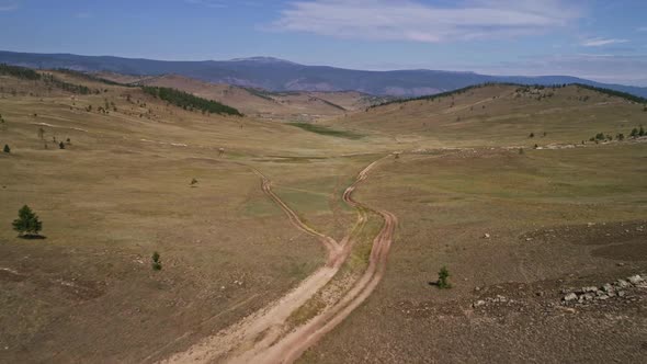 Baikal Valley spirits,Tazheran Steppe, Stone Cliffs on the Road. Aerial Summer