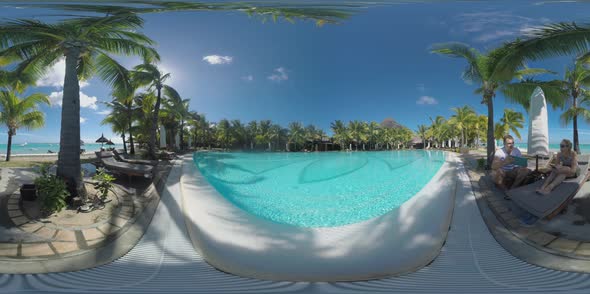 360 VR Couple of Tourists on Tropical Resort at Le Morne Brabant Peninsula, Mauritius