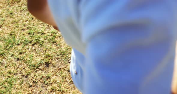 Children playing a sack race in park