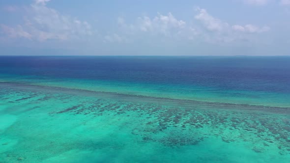 Aerial drone tourism of tranquil island beach voyage by shallow ocean with white sandy background of