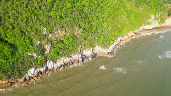 4K aerial top view, coast of mountains by the sea