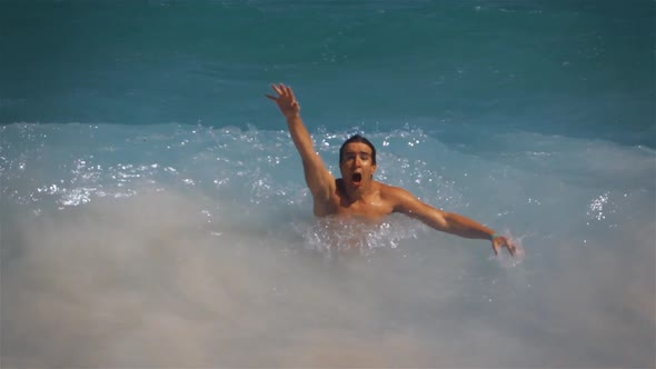 Drowning Man Trying To Swim in Sunny Ocean