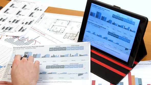 Business People Developing a Business Project and Analyzing Market Data Information