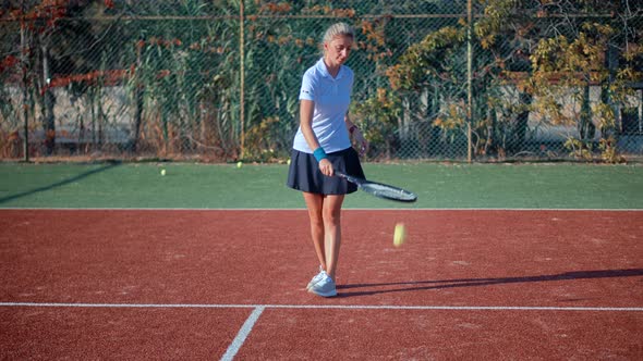 Female Tennis Player Preparing To Set Ready To Serve Ball. Girl With Rocket Playing On Tennis Court.